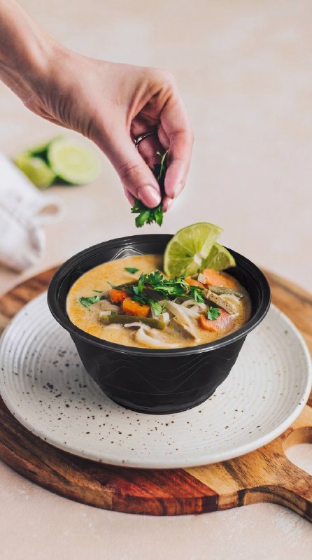 Soup in a black DK Plast “Kosa” bowl